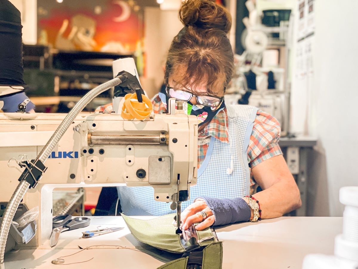 Rosa Sewing at the Road Runner Bags Workshop